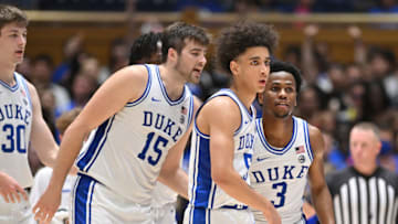 Duke basketball guards Jeremy Roach and Tyrese Proctor with center Ryan Young (Photo by Grant Halverson/Getty Images)