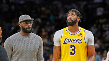 SAN ANTONIO, TX - OCTOBER 26: LeBron James of the Los Angeles Lakers who sat out the game checks on teammate Anthony Davis #3 after Davis was injured in the fourth quarter at AT&T Center on October 26, 2021 in San Antonio, Texas. The Lakers won 125-121 in overtime. NOTE TO USER: User expressly acknowledges and agrees that , by downloading and or using this photograph, User is consenting to the terms and conditions of the Getty Images License Agreement. (Photo by Ronald Cortes/Getty Images)