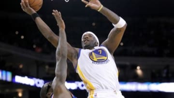 Mar 30, 2014; Oakland, CA, USA; Golden State Warriors center Jermaine O'Neal (7) shoots the ball against the New York Knicks in the third quarter at Oracle Arena. The Knicks won 89-84. Mandatory Credit: Cary Edmondson-USA TODAY Sports