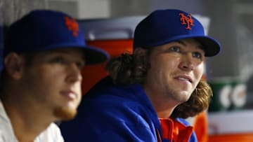 NEW YORK, NY - AUGUST 2: Zack Wheeeler #45 and Jacob deGrrom #48 of the New York Mets in the dugout during a game against the San Francisco Giants on August 2, 2014 at Citi Field in the Flushing neighborhood of the Queens borough of New York City. (Photo by Rich Schultz/Getty Images)
