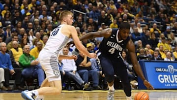 MILWAUKEE, WI - JANUARY 28: Eric Paschall #4 of the Villanova Wildcats drives around Sam Hauser #10 of the Marquette Golden Eagles during the first half at the BMO Harris Bradley Center on January 28, 2018 in Milwaukee, Wisconsin. (Photo by Stacy Revere/Getty Images)