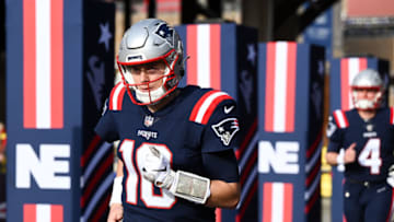 Jan 1, 2023; Foxborough, Massachusetts, USA; New England Patriots quarterback Mac Jones (10) runs onto the field before a game against the Miami Dolphins at Gillette Stadium. Mandatory Credit: Brian Fluharty-USA TODAY Sports