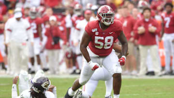 Nov 23, 2019; Tuscaloosa, AL, USA; Alabama Crimson Tide defensive lineman Christian Barmore (58) celebrates his sack on Western Carolina Catamounts quarterback Tyrie Adams (12) during the second quarter at Bryant-Denny Stadium. Mandatory Credit: John David Mercer-USA TODAY Sports