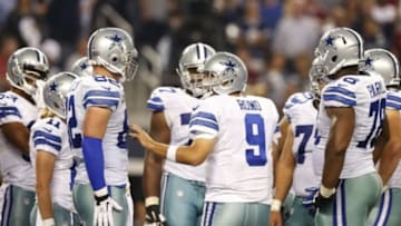 Oct 27, 2014; Arlington, TX, USA; Dallas Cowboys quarterback Tony Romo (9) talks in the huddle after returning to the game after an injury against the Washington Redskins at AT&T Stadium. Mandatory Credit: Matthew Emmons-USA TODAY Sports