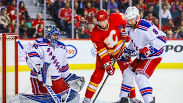 Nov 12, 2016; Calgary, Alberta, CAN; New York Rangers goalie Henrik Lundqvist (30) makes a save as Calgary Flames right wing Alex Chiasson (39) and New York Rangers defenseman Kevin Klein (8) battle for the puck during the second period at Scotiabank Saddledome. Mandatory Credit: Sergei Belski-USA TODAY Sports
