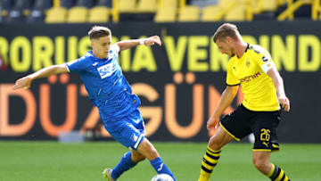 DORTMUND, GERMANY - JUNE 27: Christoph Baumgartner of TSG 1899 Hoffenheim battles for possession with Lukasz Piszczek of Borussia Dortmund during the Bundesliga match between Borussia Dortmund and TSG 1899 Hoffenheim at Signal Iduna Park on June 27, 2020 in Dortmund, Germany. (Photo by Martin Rose/Getty Images)