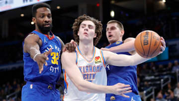 OKC Thunder guard Josh Giddey (3) passes the ball around Denver Nuggets: Alonzo Adams-USA TODAY Sports