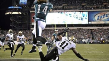 Jan 4, 2014; Philadelphia, PA, USA; Philadelphia Eagles wide receiver Riley Cooper (14) makes a touchdown catch against the New Orleans Saints during the first half 2013 NFC wild card playoff football game at Lincoln Financial Field. Mandatory Credit: Joe Camporeale-USA TODAY Sports