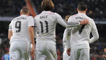 MADRID, SPAIN - MARCH 15: Gareth Bale of Real Madrid celebrates with Cristiano Ronaldo and Karim Benzema after scoring Real's opening goal during the La Liga match between Real Madrid CF and Levante UD at Estadio Santiago Bernabeu on March 15, 2015 in Madrid, Spain. (Photo by Denis Doyle/Getty Images)