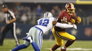 Oct 27, 2014; Arlington, TX, USA; Washington Redskins tight end Niles Paul (84) runs after a reception against Dallas Cowboys safety Barry Church (42) in the first quarter at AT&T Stadium. Mandatory Credit: Matthew Emmons-USA TODAY Sports