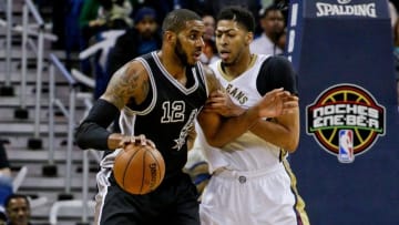 Mar 3, 2016; New Orleans, LA, USA; San Antonio Spurs forward LaMarcus Aldridge (12) is defended by New Orleans Pelicans forward Anthony Davis (23) during the first quarter of a game at the Smoothie King Center. Mandatory Credit: Derick E. Hingle-USA TODAY Sports