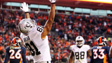 Dec 13, 2015; Denver, CO, USA; Oakland Raiders tight end Mychal Rivera (81) celebrates after scoring a touchdown during the second half against the Denver Broncos at Sports Authority Field at Mile High. The Raiders won 15-12. Mandatory Credit: Chris Humphreys-USA TODAY Sports