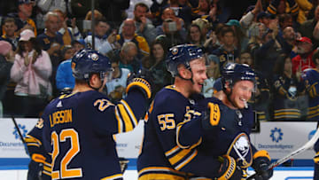 BUFFALO, NY - OCTOBER 22: Johan Larsson #22, Rasmus Ristolainen #55 and Jeff Skinner #53 of the Buffalo Sabres celebrates their overtime win against the San Jose Sharks during an NHL game on October 22, 2019 at KeyBank Center in Buffalo, New York. Buffalo won, 4-3. (Photo by Rob Marczynski/NHLI via Getty Images)