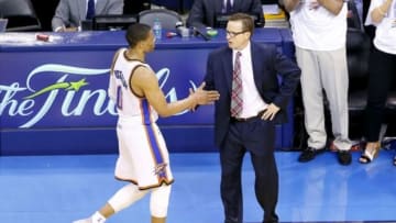May 31, 2014; Oklahoma City, OK, USA; Oklahoma City Thunder guard Russell Westbrook (0) shakes hands with head coach Scott Brooks in the final seconds of their game against the San Antonio Spurs in game six of the Western Conference Finals of the 2014 NBA Playoffs at Chesapeake Energy Arena. San Antonio won 112-107. Mandatory Credit: Alonzo Adams-USA TODAY Sports