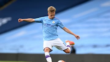 MANCHESTER, ENGLAND - JUNE 22: Oleksandr Zinchenko of Manchester City crosses the ball during the Premier League match between Manchester City and Burnley FC at Etihad Stadium on June 22, 2020 in Manchester, England. (Photo by Shaun Botterill/Getty Images)