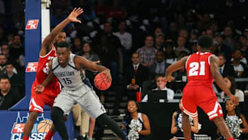 Nov 20, 2015; New York, NY, USA; Georgetown Hoyas center Jessie Govan (15) drives against Wisconsin Badgers forward Vitto Brown (30) during the second half at Madison Square Garden. Georgetown Hoyas won 71-61. Mandatory Credit: Anthony Gruppuso-USA TODAY Sports