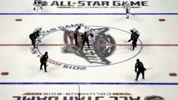 Jan 25, 2015; Columbus, OH, USA; Team Toews center Jonathan Toews (19) of the Chicago Blackhawks takes a face off against Team Foligno center Zemgus Girgensons (28) of the Buffalo Sabres in the third period in the 2015 NHL All Star Game at Nationwide Arena. Mandatory Credit: Andrew Weber-USA TODAY Sports