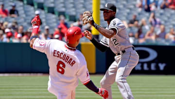 Jul 17, 2016; Anaheim, CA, USA; Chicago White Sox shortstop Tim Anderson (12) throws to first as Los Angeles Angels third baseman Yunel Escobar (6) breaks up a double play in the sixth inning of the game at Angel Stadium of Anaheim. Mandatory Credit: Jayne Kamin-Oncea-USA TODAY Sports