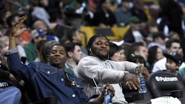 Apr 11, 2016; Boston, MA, USA; New England Patriots players Malcom Butler (left) and Jamie Collins pose for a photo during the second half in a game between the Boston Celtics and the Charlotte Hornets at TD Garden. Mandatory Credit: Bob DeChiara-USA TODAY Sports