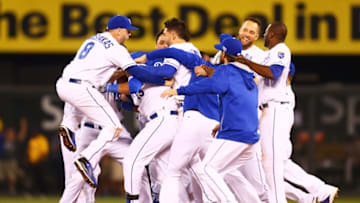 KANSAS CITY, MO - SEPTEMBER 30: The Kansas City Royals celebrate their 9 to 8 win over the Oakland Athletics in the 12th inning of their American League Wild Card game at Kauffman Stadium on September 30, 2014 in Kansas City, Missouri. (Photo by Dilip Vishwanat/Getty Images)
