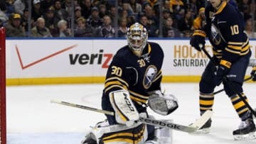 Jan 18, 2014; Buffalo, NY, USA; Buffalo Sabres goalie Ryan Miller (30) makes a pad save during the first period against the Columbus Blue Jackets at First Niagara Center. Mandatory Credit: Timothy T. Ludwig-USA TODAY Sports