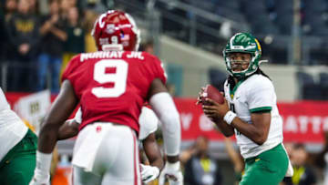 Dec 7, 2019; Arlington, TX, USA; Baylor Bears quarterback Gerry Bohanon (11) throws as Oklahoma Sooners linebacker Kenneth Murray (9) defends during the first half in the 2019 Big 12 Championship Game at AT&T Stadium. Mandatory Credit: Kevin Jairaj-USA TODAY Sports