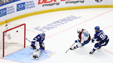 Jun 22, 2022; Tampa, Florida, USA; Colorado Avalanche center Nazem Kadri (91) scores the game winning goal against Tampa Bay Lightning goaltender Andrei Vasilevskiy (88) during overtime in game four of the 2022 Stanley Cup Final at Amalie Arena. Mandatory Credit: Mark J. Rebilas-USA TODAY Sports