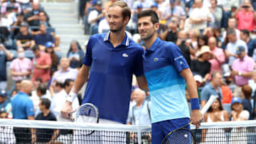 NEW YORK, NEW YORK - SEPTEMBER 12: (L-R) Daniil Medvedev of Russia and Novak Djokovic of Serbia smile at center court before the Men's Singles final match on Day Fourteen of the 2021 US Open at the USTA Billie Jean King National Tennis Center on September 12, 2021 in the Flushing neighborhood of the Queens borough of New York City. (Photo by Matthew Stockman/Getty Images)