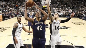 Dec 18, 2016; San Antonio, TX, USA; New Orleans Pelicans center Alexis Ajinca (42) shoots the ball as San Antonio Spurs shooting guard Danny Green (14) defends during the second half at AT&T Center. Mandatory Credit: Soobum Im-USA TODAY Sports