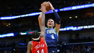 Kristaps Porzingis #6 of the Dallas Mavericks shoots against Brandon Ingram #14 of the New Orleans Pelicans . (Photo by Jonathan Bachman/Getty Images)