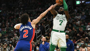 Feb 16, 2022; Boston, Massachusetts, USA; Boston Celtics guard Jaylen Brown (7) attempts a basket in front of Detroit Pistons guard Cade Cunningham (2) during the second half at the TD Garden. Mandatory Credit: Brian Fluharty-USA TODAY Sports