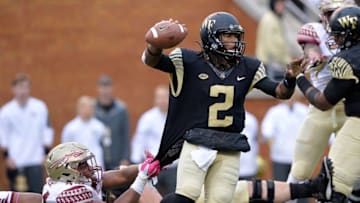 WINSTON SALEM, NC - OCTOBER 03: DeMarcus Walker #44 of the Florida State Seminoles grabs the jersey of Kendall Hinton #2 of the Wake Forest Demon Deacons during their game at BB&T Field on October 3, 2015 in Winston Salem, North Carolina. Florida State won 24-16. (Photo by Grant Halverson/Getty Images)