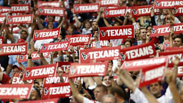 HOUSTON, TX- SEPTEMBER 29: Houston Texans fans hold Texans signs while the Houston Texans are introduced before playing against the Seattle Seahawks on September 29, 2013 at Reliant Stadium in Houston, Texas. (Photo by Thomas B. Shea/Getty Images)