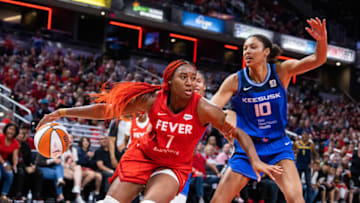 South Carolina basketball alum Aliyah Boston is off to a torrid start to her WNBA career. May 19, 2023; Indianapolis, Indiana, USA; Indiana Fever forward Aliyah Boston (7) dribbles the ball while Connecticut Sun center Olivia Nelson-Ododa (10) defends in the second half at Gainbridge Fieldhouse. Mandatory Credit: Trevor Ruszkowski-USA TODAY Sports