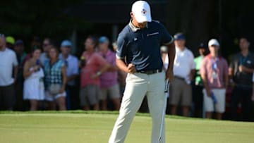 Aug 20, 2016; Greensboro, NC, USA; Si Woo Kim reacts to a birdie on the 18th hole during the third round of the 2016 Wyndham Championship. at Sedgefield Country Club. Mandatory Credit: Rob Kinnan-USA TODAY Sports