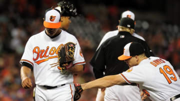 Jun 7, 2016; Baltimore, MD, USA; Baltimore Orioles pitcher Ubaldo Jimenez (31) is congratulated by first baseman Chris Davis (19) after being taken out of the game in the fifth inning against the Kansas City Royals at Oriole Park at Camden Yards. The Orioles won 9-1. Mandatory Credit: Evan Habeeb-USA TODAY Sports