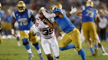 LOS ANGELES, CALIFORNIA - SEPTEMBER 14: Nik Bonitto #35 of the Oklahoma Sooners sacks Dorian Thompson-Robinson #1 of the UCLA Bruins during the second half of a game on at the Rose Bowl on September 14, 2019 in Los Angeles, California. (Photo by Sean M. Haffey/Getty Images)