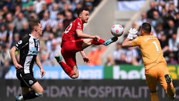 NEWCASTLE UPON TYNE, ENGLAND - APRIL 30: Diogo Jota of Liverpool battles for possession with Martin Dubravka of Newcastle United during the Premier League match between Newcastle United and Liverpool at St. James Park on April 30, 2022 in Newcastle upon Tyne, England. (Photo by Stu Forster/Getty Images)