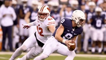 INDIANAPOLIS, IN - DECEMBER 03: Trace McSorley #9 of the Penn State Nittany Lions is chased out of the pocket by T.J. Watt #42 of the Wisconsin Badgers during the first quarter of the Big Ten Championship game at Lucas Oil Stadium on December 3, 2016 in Indianapolis, Indiana. (Photo by Bobby Ellis/Getty Images)