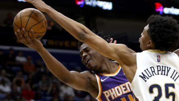 Aaron Holiday #4 of the Phoenix Suns is blocked by Trey Murphy III #25 of the New Orleans Pelicans Gardner/Getty Images) (Photo by Sean Gardner/Getty Images)