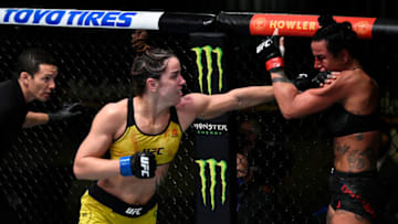LAS VEGAS, NEVADA - NOVEMBER 28: In this handout image provided by the UFC, Norma Dumont (L) of Brazil punches Ashlee Evans-Smith in their women's bantamweight bout during the UFC Fight Night at UFC APEX on November 28, 2020 in Las Vegas, Nevada. (Photo by Chris Unger/Zuffa LLC via Getty Images)