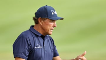 CROMWELL, CONNECTICUT - JUNE 26: Phil Mickelson of the United States reacts after making a putt for birdie on the 18th green during the second round of the Travelers Championship at TPC River Highlands on June 26, 2020 in Cromwell, Connecticut. (Photo by Elsa/Getty Images)