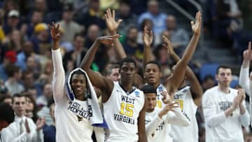 BUFFALO, NY - MARCH 18: The bench of the West Virginia Mountaineers reacts after a play against the Notre Dame Fighting Irish during the second round of the 2017 NCAA Men's Basketball Tournament at KeyBank Center on March 18, 2017 in Buffalo, New York. (Photo by Elsa/Getty Images)