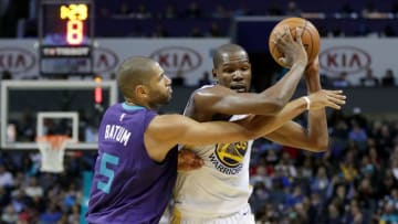 CHARLOTTE, NC - DECEMBER 06: Kevin Durant #35 of the Golden State Warriors tries to keep the ball from Nicolas Batum #5 of the Charlotte Hornets during their game at Spectrum Center on December 6, 2017 in Charlotte, North Carolina. NOTE TO USER: User expressly acknowledges and agrees that, by downloading and or using this photograph, User is consenting to the terms and conditions of the Getty Images License Agreement. (Photo by Streeter Lecka/Getty Images)