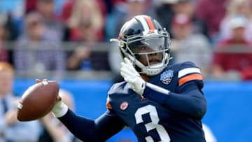 CHARLOTTE, NORTH CAROLINA - DECEMBER 29: Bryce Perkins #3 of the Virginia Cavaliers looks to pass against the South Carolina Gamecocks during the first half of the Belk Bowl at Bank of America Stadium on December 29, 2018 in Charlotte, North Carolina. (Photo by Grant Halverson/Getty Images)