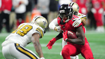 ATLANTA, GA - DECEMBER 7: Julio Jones #11 of the Atlanta Falcons is tackled by Marshon Lattimore #23 and Vonn Bell #48 of the New Orleans Saints at Mercedes-Benz Stadium on December 7, 2017 in Atlanta, Georgia. (Photo by Scott Cunningham/Getty Images)