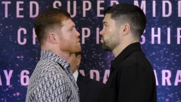 ZAPOPAN, MEXICO - MARCH 14: Saul Canelo Alvarez (L) and John Ryder (R) face off during the press conference at Akron Stadium on March 14, 2023 in Zapopan, Mexico. Canelo Alvarez will fight against John Ryder on May 6, 12 years after his last combat in Mexico. The event will take place at Akron Stadium. (Photo by Alfredo Moya/Jam Media/Getty Images)