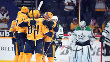 Nashville Predators players celebrate a second period goal by center Yakov Trenin (13) past Dallas Stars goaltender Anton Khudobin (35) at Bridgestone Arena. Mandatory Credit: Christopher Hanewinckel-USA TODAY Sports
