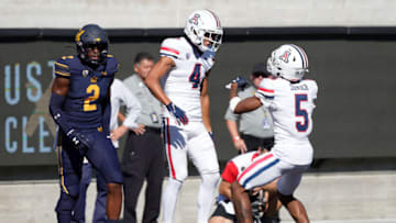 Sep 24, 2022; Berkeley, California, USA; Arizona Wildcats wide receiver Tetairoa McMillan (4) celebrates with wide receiver Dorian Singer (5) after scoring a touchdown against the California Golden Bears during the second quarter at FTX Field at California Memorial Stadium. Mandatory Credit: Darren Yamashita-USA TODAY Sports