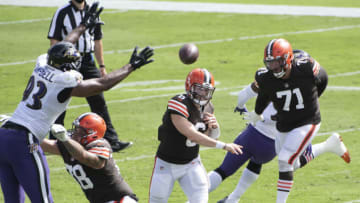 Sep 13, 2020; Baltimore, Maryland, USA; Cleveland Browns quarterback Baker Mayfield (6) throws a sBaltimore Ravens defensive end Calais Campbell (93) defends during the first half at M&T Bank Stadium. Mandatory Credit: Tommy Gilligan-USA TODAY Sports